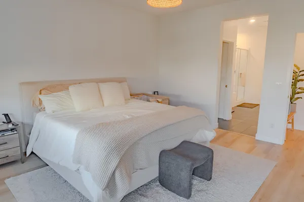 a bedroom with a bed and a couch