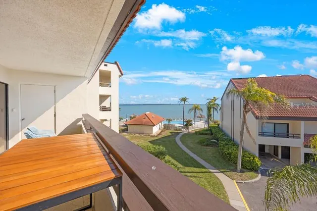 a view of swimming pool with outdoor seating and city view