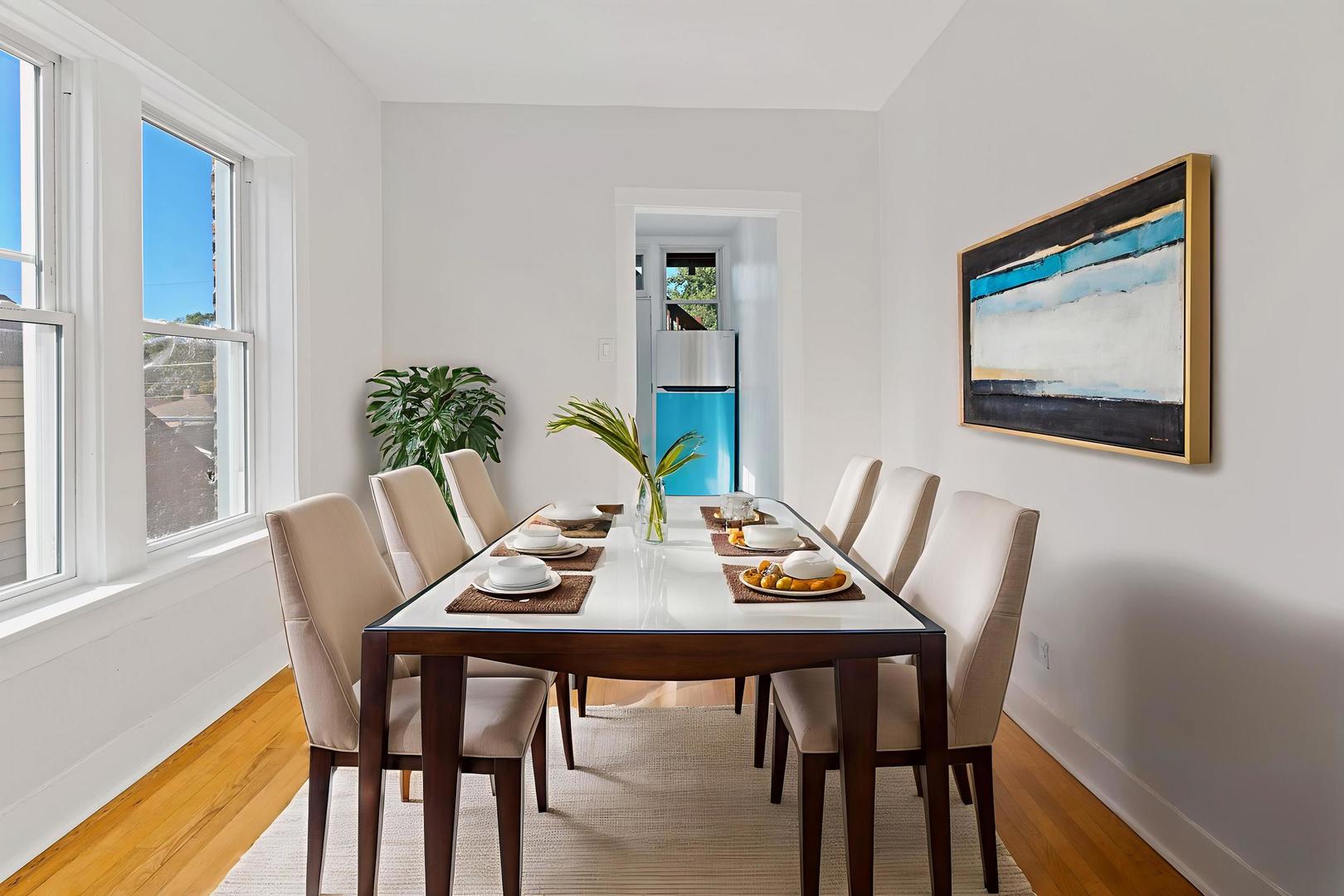 10342 South Calumet Avenue, Unit 3 Chicago, IL 60628 - Photo 5 of 25 a view of a dining room with furniture window and wooden floor
