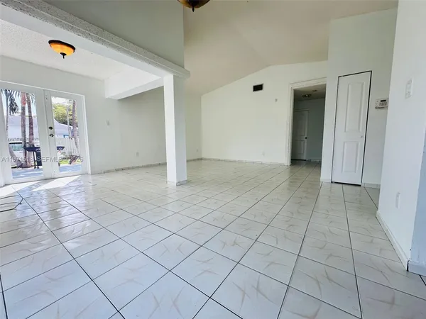 a view of a livingroom with an empty space and a sink