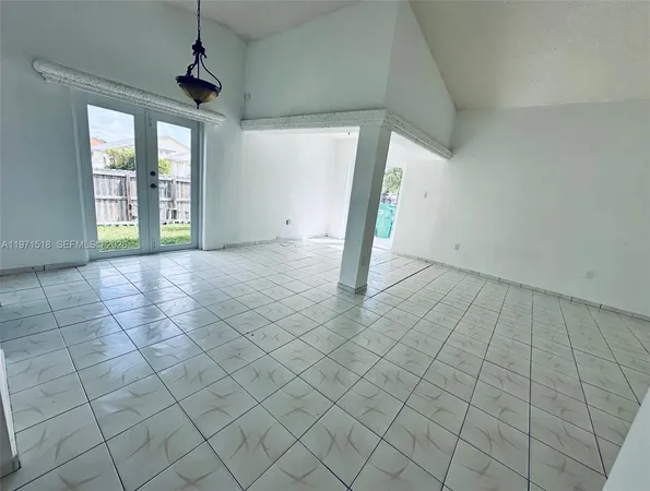 a view of an empty room and window