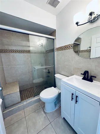a bathroom with a toilet and a sink