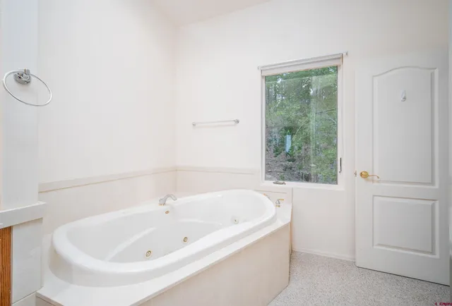 a bathroom with a bathtub and a sink