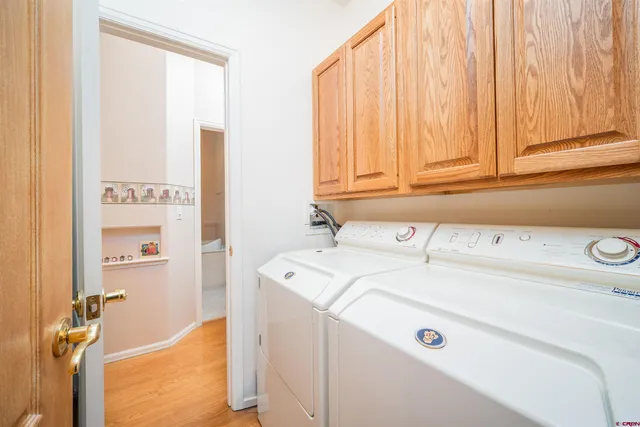 an empty room with a window and a ceiling fan