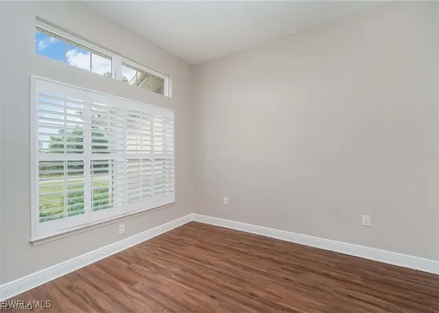 a bathroom with a granite countertop sink a large mirror and a shower