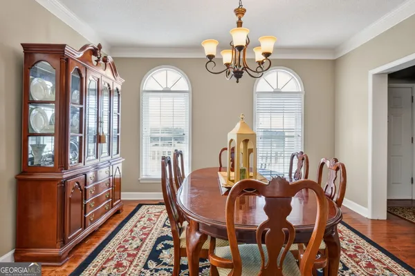 a view of a dining room with furniture and window