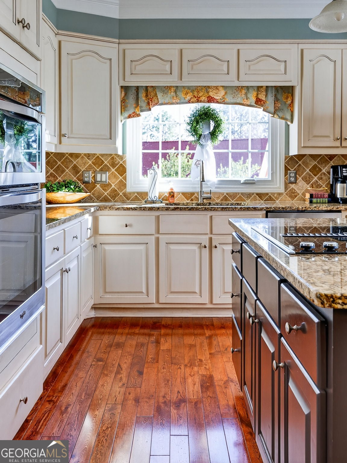 312 Pinnacle Park Macon, GA 31220 - Photo 15 of 63 a kitchen with stainless steel appliances granite countertop a stove a sink and a microwave