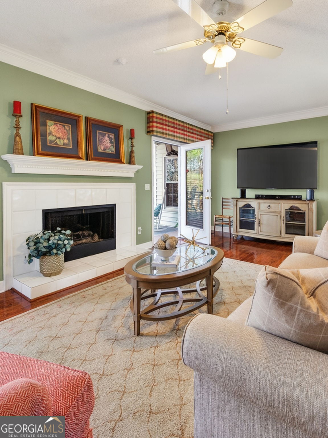 312 Pinnacle Park Macon, GA 31220 - Photo 24 of 63 a living room with furniture a flat screen tv and a fireplace