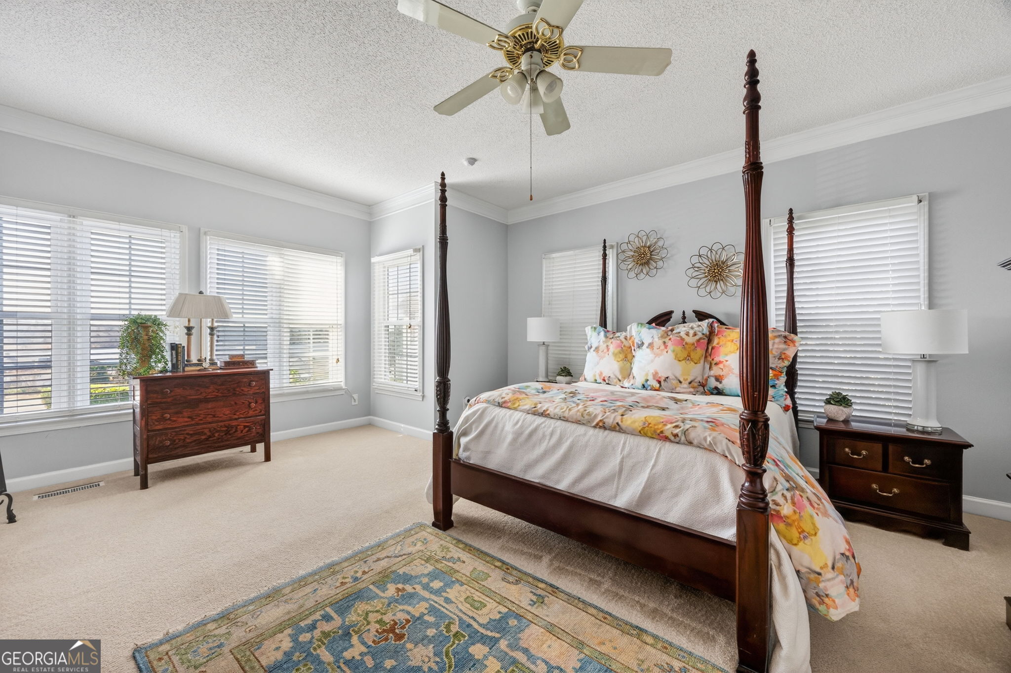 312 Pinnacle Park Macon, GA 31220 - Photo 26 of 63 a bedroom with a bed a dresser and potted plant