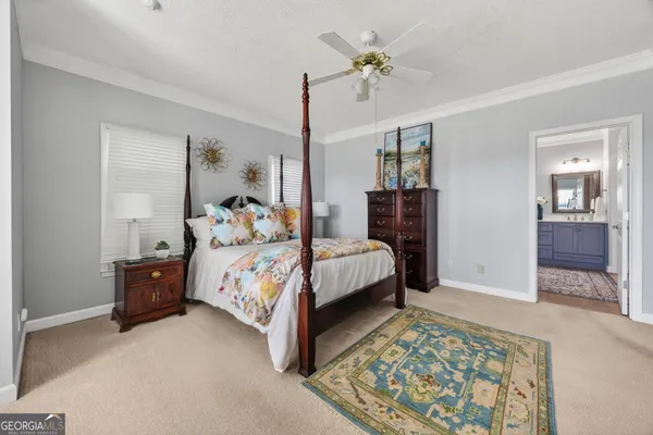 a view of a livingroom with furniture and an entryway