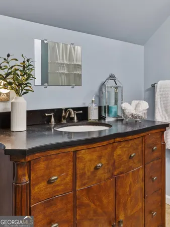 a view of living room filled with furniture and a potted plant