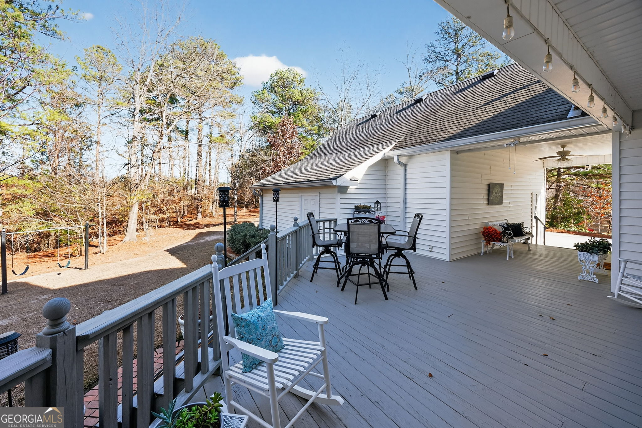 312 Pinnacle Park Macon, GA 31220 - Photo 50 of 63 a view of a patio with table and chairs with wooden floor and fence