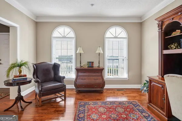 a living room with furniture and a rug