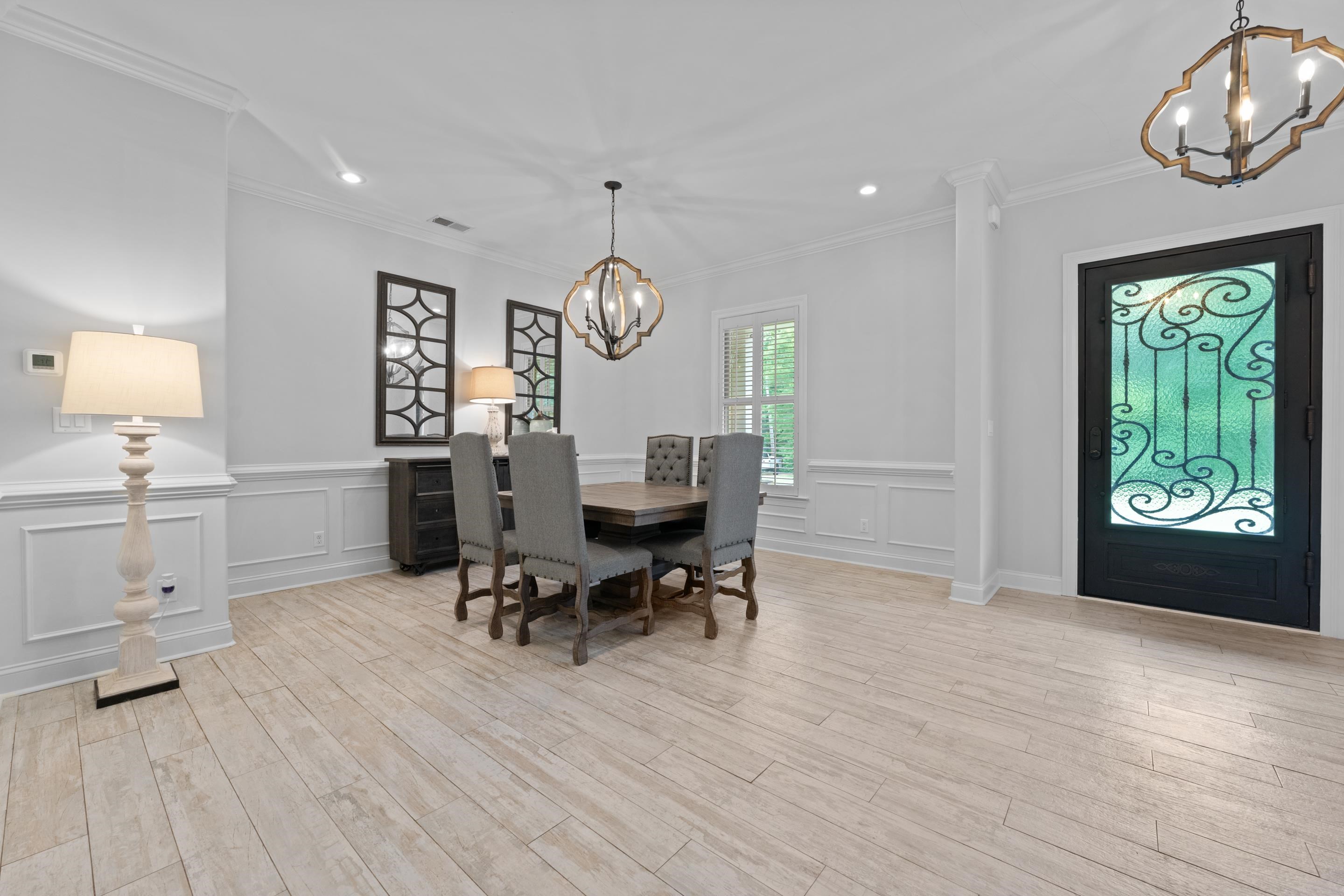10354 Pleasant Ridge Road Arlington, TN 38002 - Photo 6 of 40 The spacious dining room offers the perfect setting for holidays, dinner parties, or everyday gatherings. Gorgeous lighting, detailed molding, and an open layout give this space both charm and functionality.