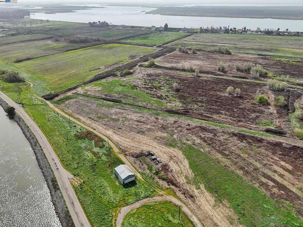 -00 Brannan Isle Road Isleton, CA 95641 - Photo 3 of 19 a view of a water pond with green field
