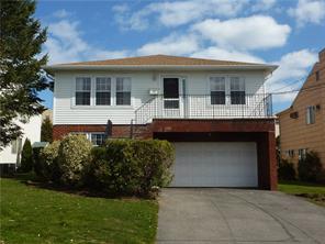 118 Bell Road Scarsdale, NY 10583 - Photo 1 of 1 a front view of a house with a garden and plants