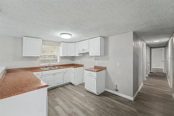 a kitchen with stainless steel appliances granite countertop a sink and cabinets
