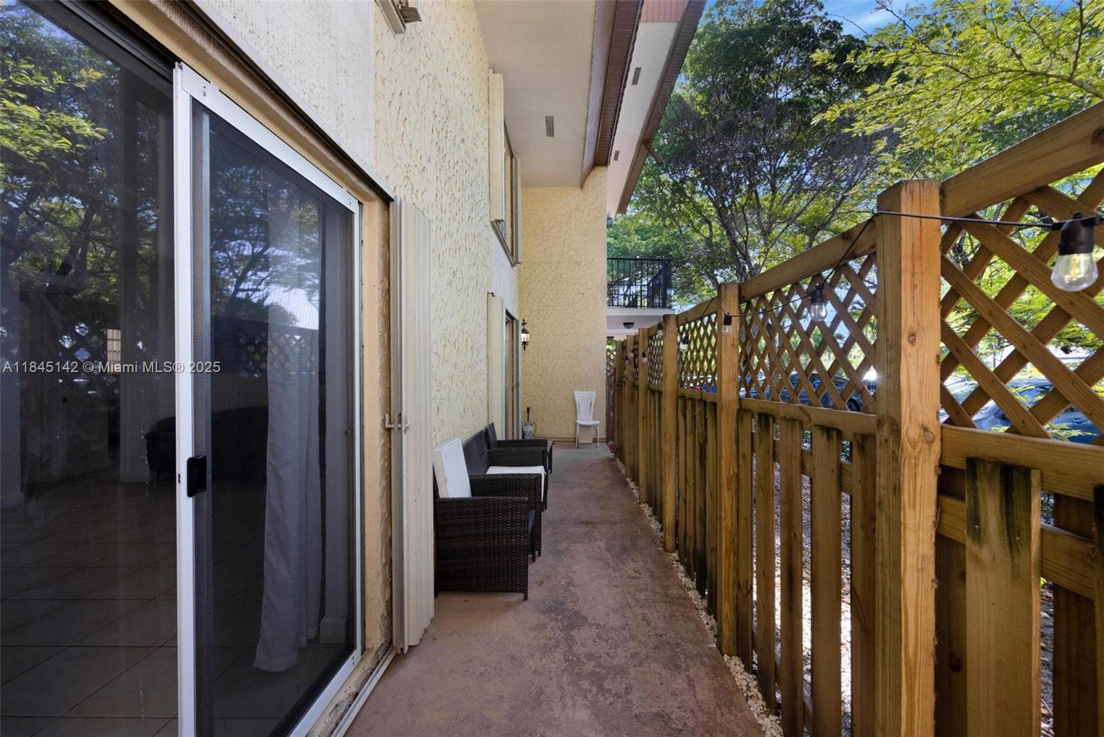 8500 Southwest 109th Avenue, Unit 6112 Miami, FL 33173 - Photo 12 of 52 a view of a porch with wooden floor and stairs