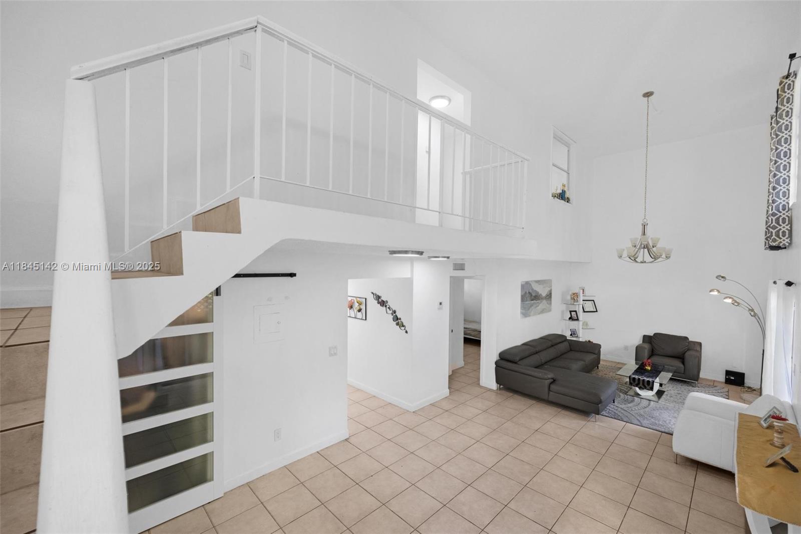 8500 Southwest 109th Avenue, Unit 6112 Miami, FL 33173 - Photo 21 of 52 a living room with furniture and white walls