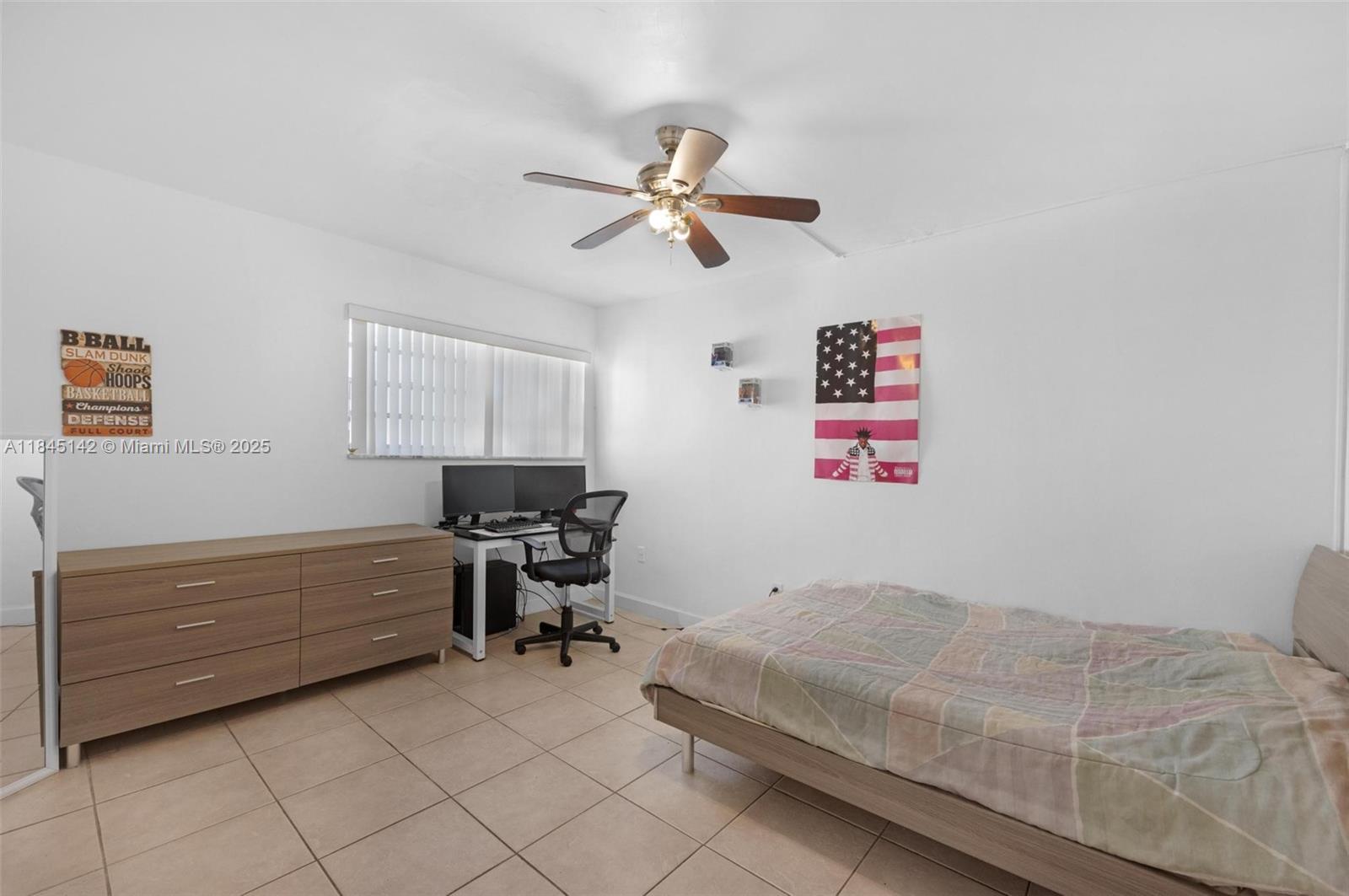 8500 Southwest 109th Avenue, Unit 6112 Miami, FL 33173 - Photo 29 of 52 a bedroom with a bed and a chandelier