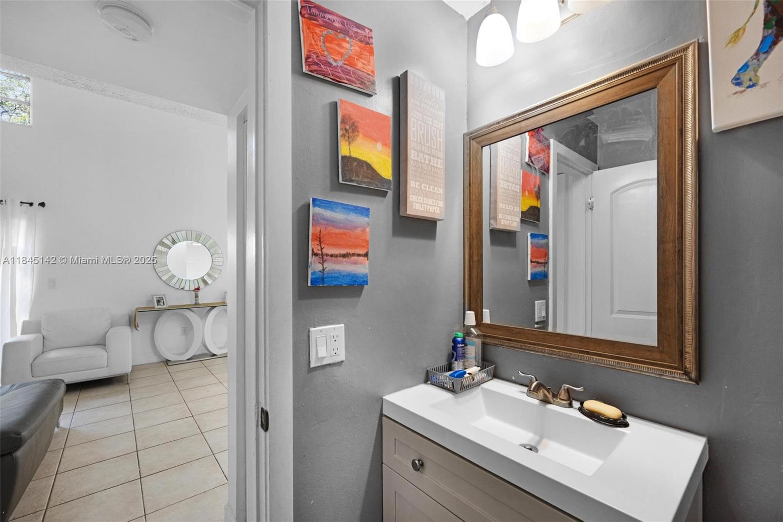 8500 Southwest 109th Avenue, Unit 6112 Miami, FL 33173 - Photo 8 of 52 a bathroom with a sink mirror and vanity