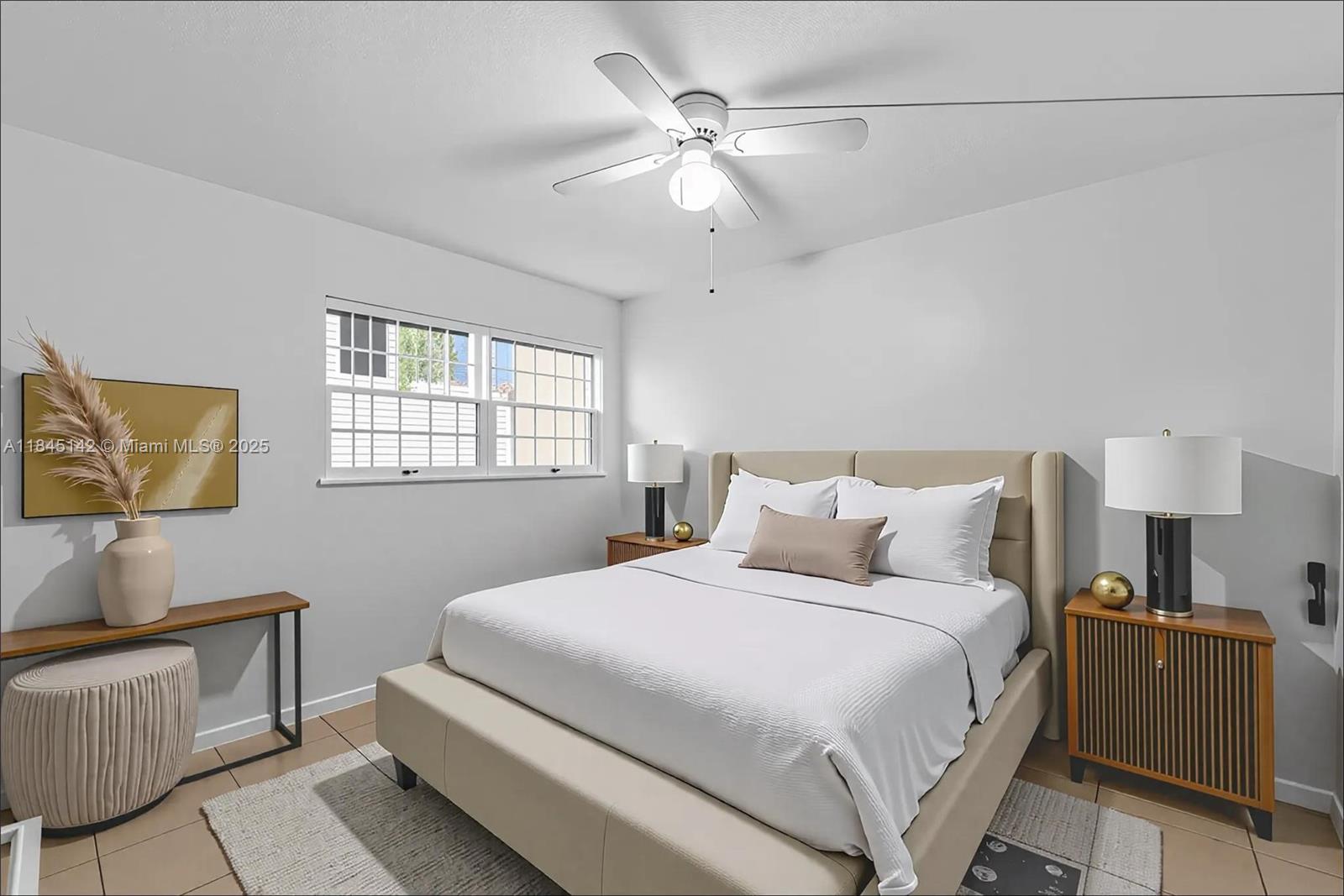 8500 Southwest 109th Avenue, Unit 6112 Miami, FL 33173 - Photo 10 of 52 a bedroom with a bed and a lamp on dresser