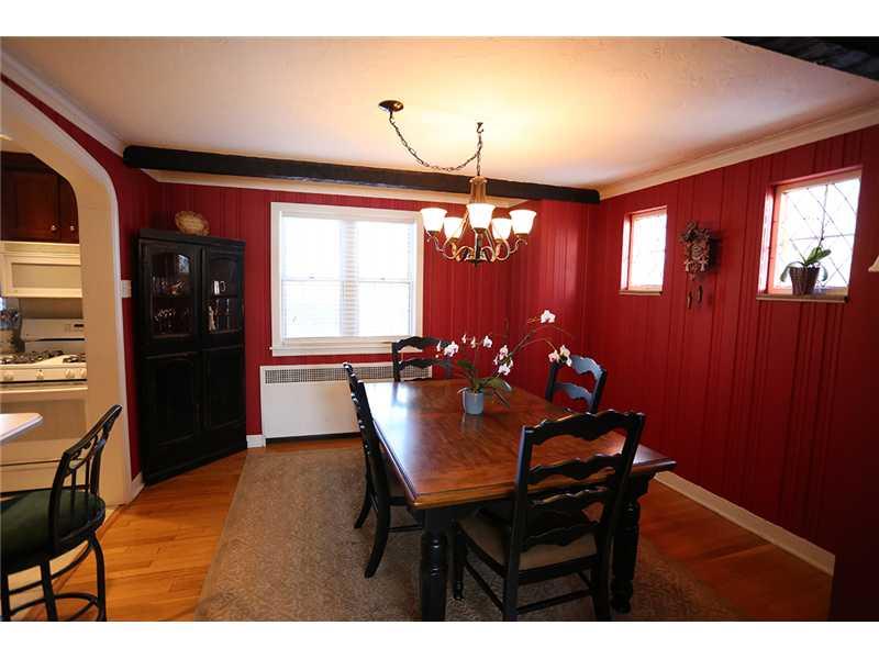 335 Marshall Road Bethel Park, PA 15102 - Photo 3 of 25 Dining Room. The dining room pops with the dark red walls, beamed ceilings, hardwood floor and the room is open to the kitchen making entertaining a joy.