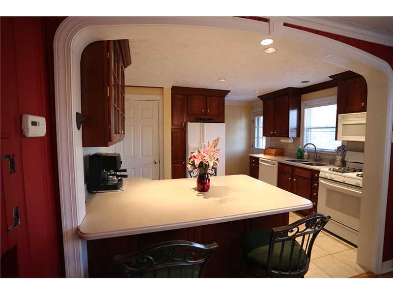 335 Marshall Road Bethel Park, PA 15102 - Photo 4 of 25 Kitchen. The newer eat-in-kitchen boasts plenty of cherry cabinets, ceramic tile floor and Corian counter tops. The eat-at kitchen island allows the chef to enjoy guests. The back door opens to a patio and a phenomenal back yard.