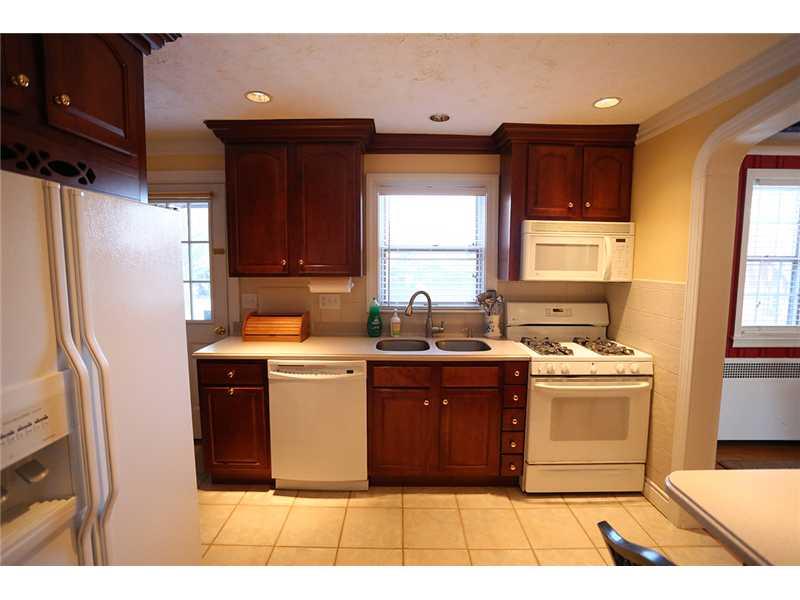 335 Marshall Road Bethel Park, PA 15102 - Photo 6 of 25 Kitchen. The kitchen comes equipped with a gas stove, microwave, dishwasher, disposal and refrigerator.