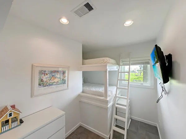 a room with a window and a couch
