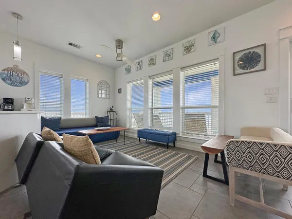 a living room with furniture and a window