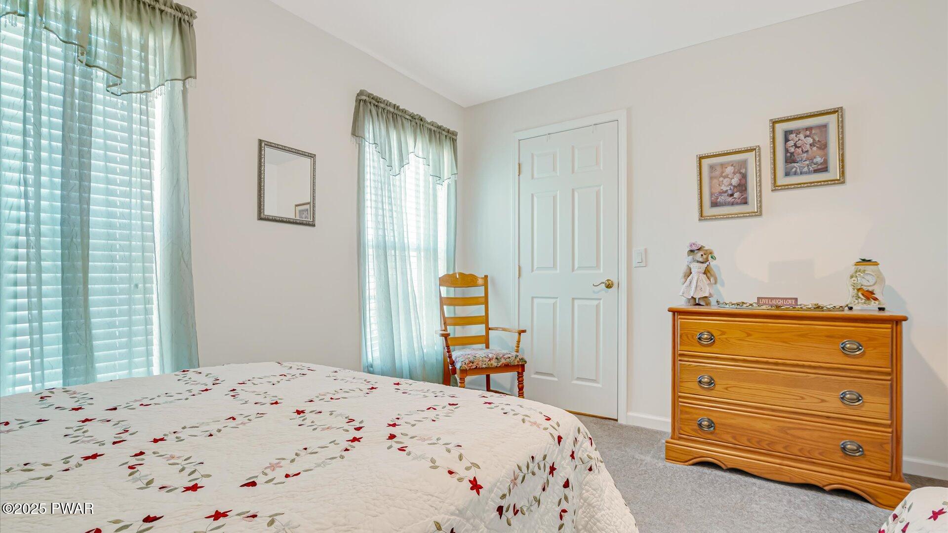 66 Boulder Road Lake Ariel, PA 18436 - Photo 30 of 51 a bedroom with a bed and wooden floor