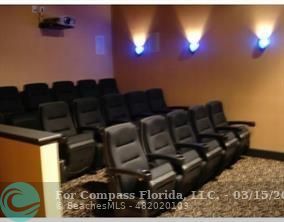 1830 Radius Drive, Unit 1417 Hollywood, FL 33020 - Photo 6 of 6 a living room with furniture and a fireplace