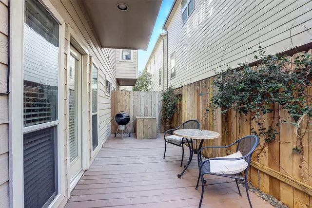 a view of a chairs with a table and chair in the balcony