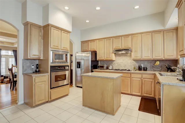 a kitchen with cabinets and appliances