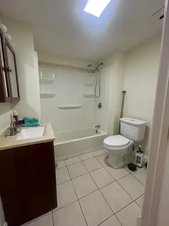 a bathroom with a sink toilet and vanity
