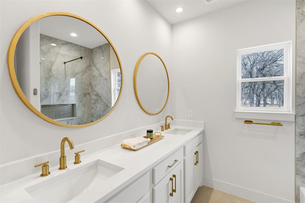 428 Squaw Creek Road Willow Park, TX 76087 - Photo 29 of 34 a bathroom with a sink and a mirror