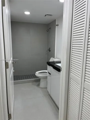 a view of a hallway with cabinet