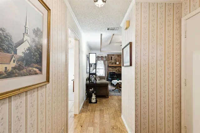 a view of a hallway with furniture and front door