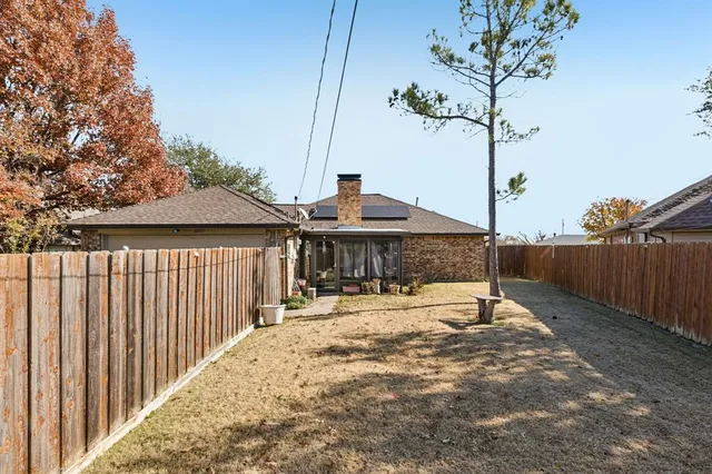 a view of a backyard with a sitting area
