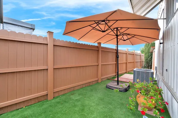 a view of a backyard with hardwood