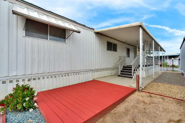 a view of a porch with wooden stairs