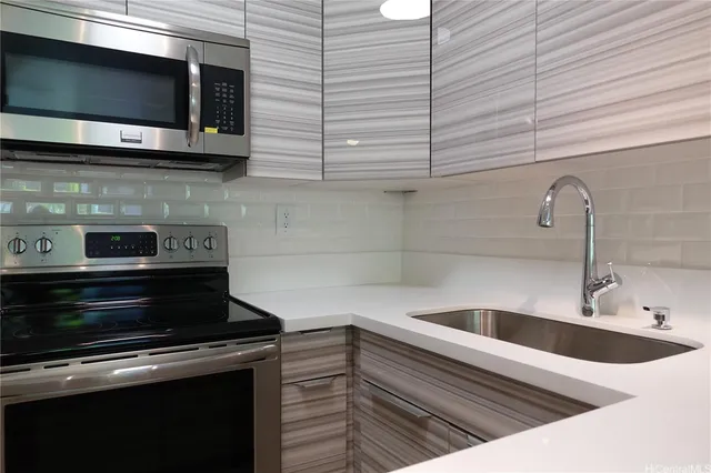 a kitchen with a sink and cabinets