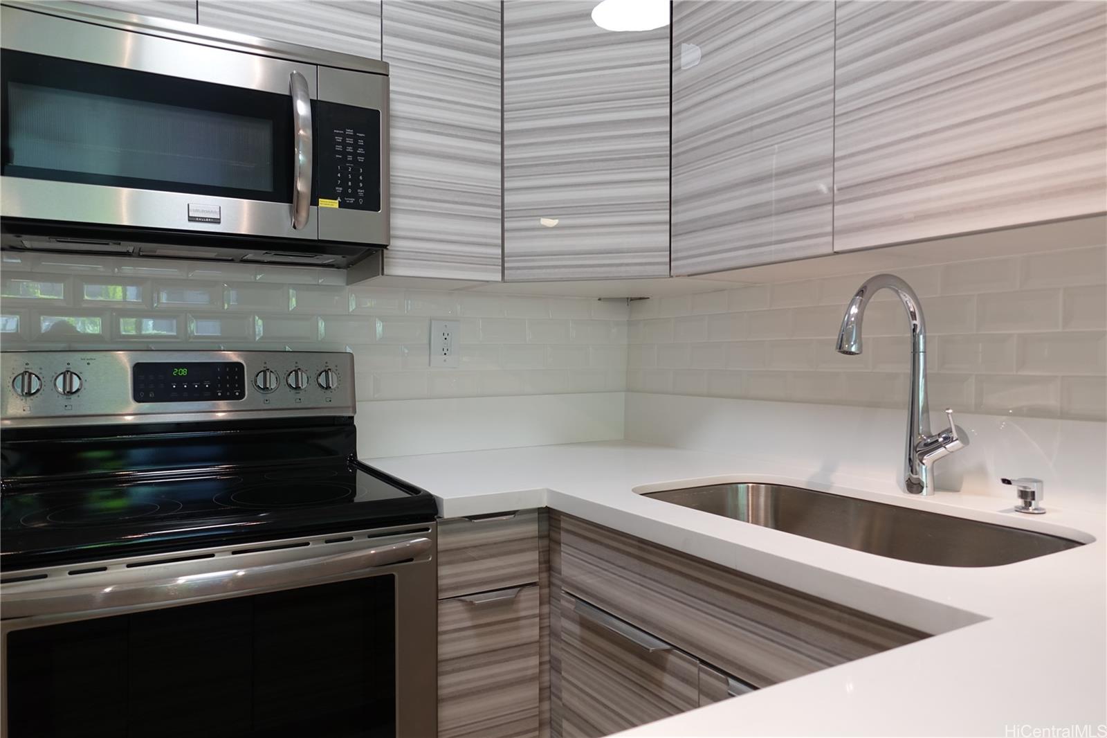 350 Aoloa Street, Unit A111 Kailua, HI 96734 - Photo 1 of 24 a kitchen with a sink and cabinets