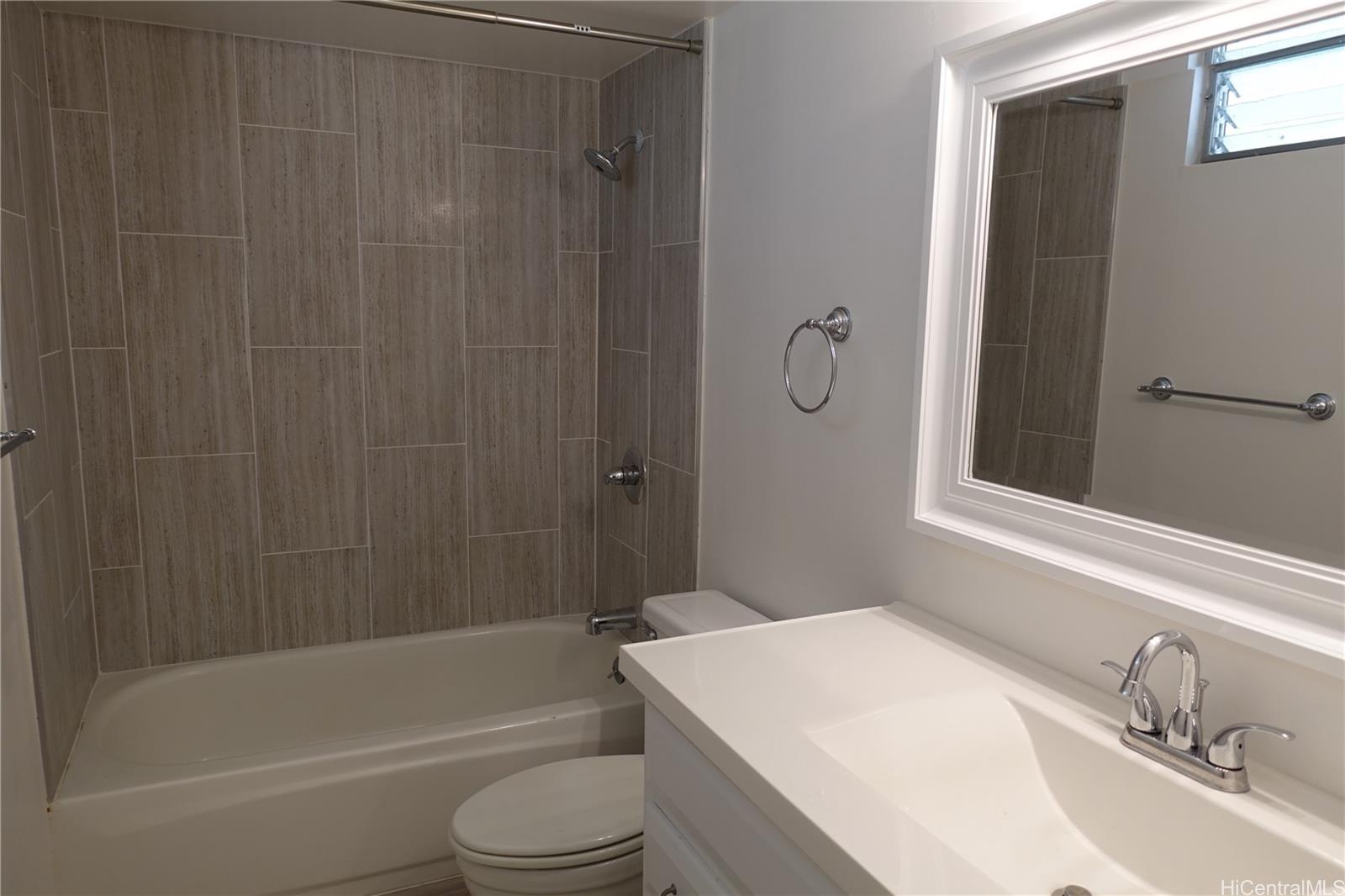 350 Aoloa Street, Unit A111 Kailua, HI 96734 - Photo 12 of 24 a bathroom with a sink a toilet and shower