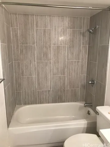 a kitchen with a refrigerator and a sink