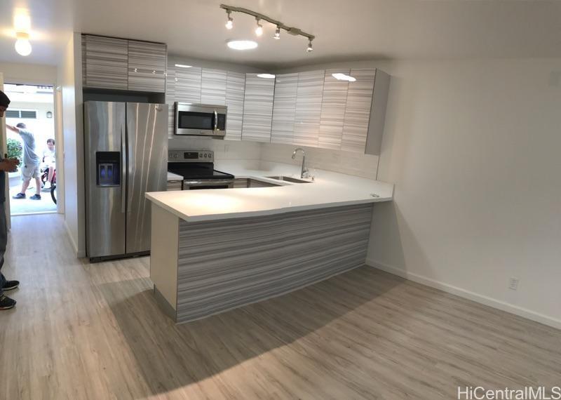 350 Aoloa Street, Unit A111 Kailua, HI 96734 - Photo 16 of 24 a kitchen with a refrigerator and a sink