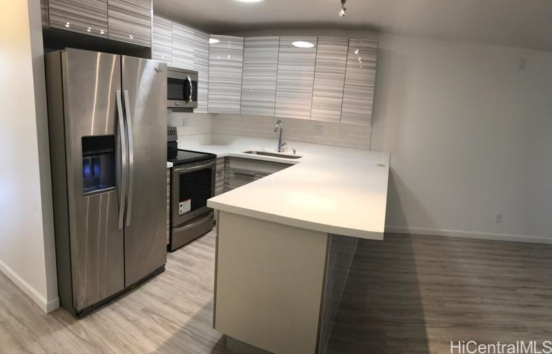 350 Aoloa Street, Unit A111 Kailua, HI 96734 - Photo 17 of 24 a kitchen with stainless steel appliances a refrigerator and a sink