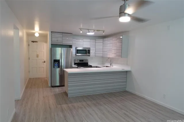 a view of room with closet and wooden floor