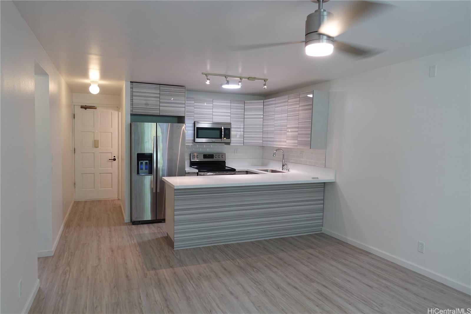 350 Aoloa Street, Unit A111 Kailua, HI 96734 - Photo 4 of 24 a view of room with closet and wooden floor